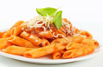 Penne pasta with meat-based tomato sauce and cheese
