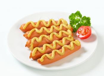 Frankfurter sausages with mustard sauce