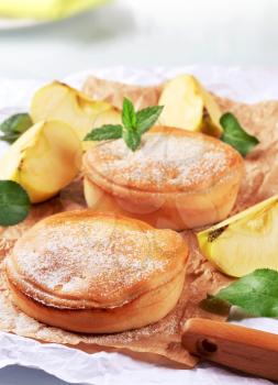 Delicious apple pies sprinkled with icing sugar
