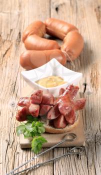 Roasted sausages, bread and mustard - still