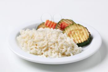 Grilled zucchini and white rice on a plate