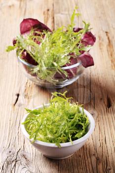 Bowls of fresh salad greens - closeup