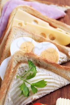 Ham, cheese and egg sandwiches - detail
