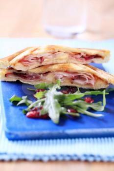 Bacon and cheese toasted sandwiches and arugula