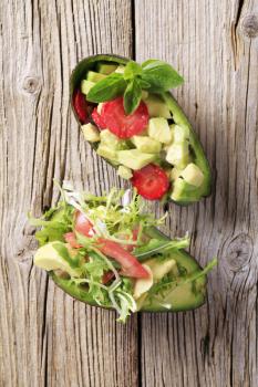 Avocado halves filled with avocado salads - closeup
