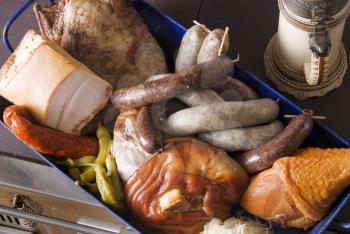 Variety of meat products in a baking pan