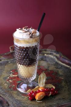 Liqueur coffee with whipped cream in a tall glass