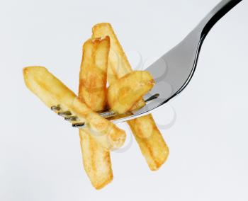 French fries on a fork - studio