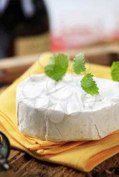 Wheel of soft white rind cheese