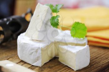 Soft cheese covered with edible white mold