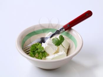 Cubes of cream cheese in bowl