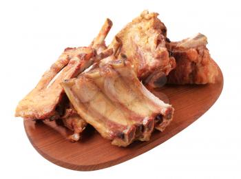 Oven-roasted pork ribs on a cutting board