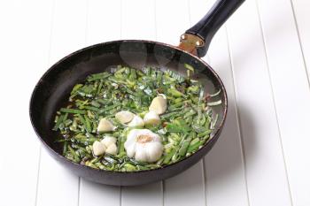 Stir frying spring onion and garlic