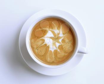 Cup of latte with froth art - overhead