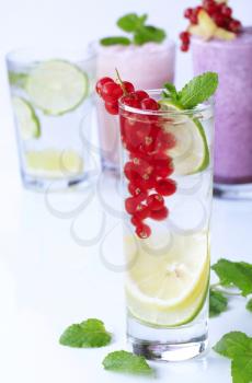 Glasses of soda with lime and fruit smoothies 