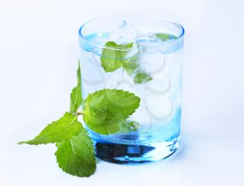 Glass of iced drink with fresh mint