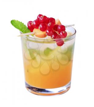 Glass of iced drink garnished with fresh fruit - cut out on white
