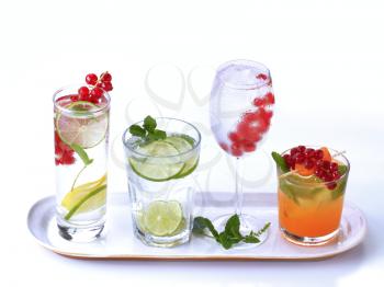Iced drinks garnished with fresh fruit 