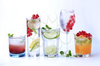 Iced drinks garnished with fresh fruit - studio
