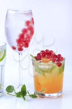Iced drinks garnished with fresh fruit - studio