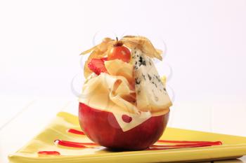 Pieces of cheese on a red apple