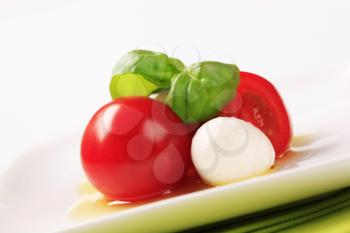 Baby mozzarella cheese balls, tomatoes and basil