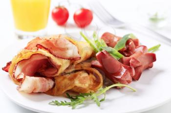 Fried breakfast - Omelet with bacon and sausages