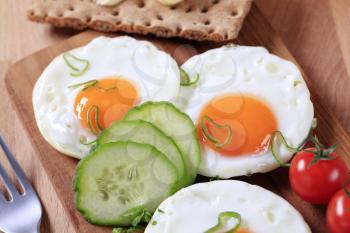 Breakfast - Fried eggs, crisp bread and fresh vegetables
