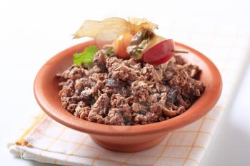 Chocolate breakfast cereal in a terracotta bowl