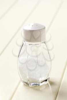 Table salt in a glass salt shaker 