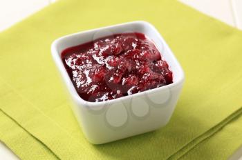 Berry fruit sauce in a small square dish