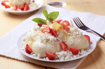 Fruit dumplings with cottage cheese, sugar, butter and strawberries