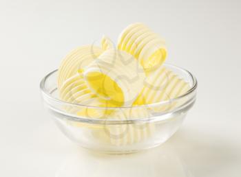 Butter curls in a glass bowl
 - studio shot