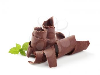 Chocolate curls on white background - closeup