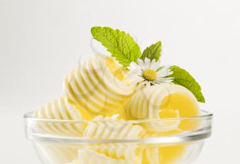 Butter curls in a glass bowl
 - detail
