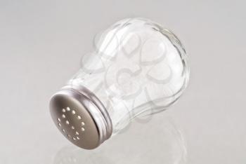 Glass salt shaker with stainless steel top