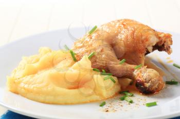 Roasted chicken quarter served with mashed potato