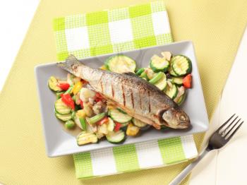 Grilled trout served with mixed vegetables