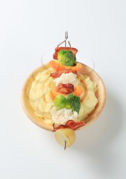 Bacon and vegetable skewer and mashed potato