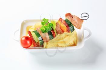 Pork and vegetable skewer with mashed potato