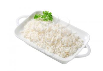 Boiled white rice in a porcelain dish