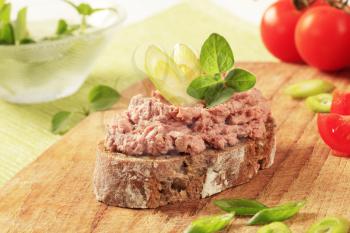 Slice of brown bread and meat spread
