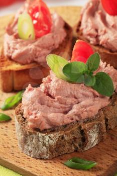 Slices of bread with smooth meat spread