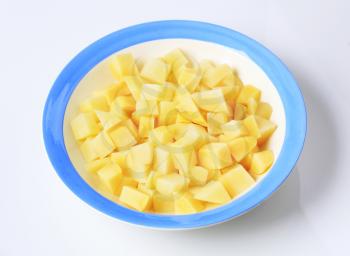 Diced boiled potatoes in a plate