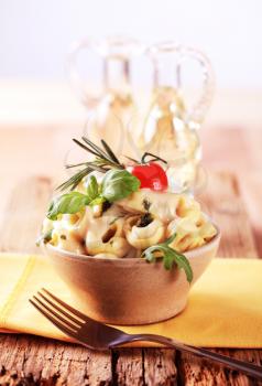 Bowl of tortellini with pesto and sauce