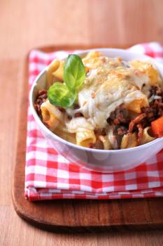 Pasta alla Bolognese with melted cheese on top