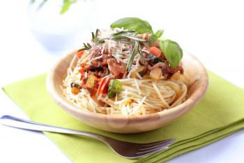 Spaghetti and meat-based sauce sprinkled with cheese