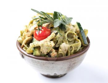 Pasta with chicken meat and courgette in cream sauce