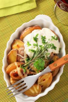Baked potatoes with cheese and sour cream