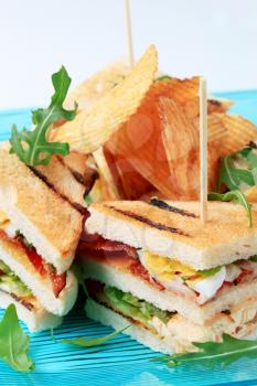 Grilled turkey and bacon sandwiches and crisps